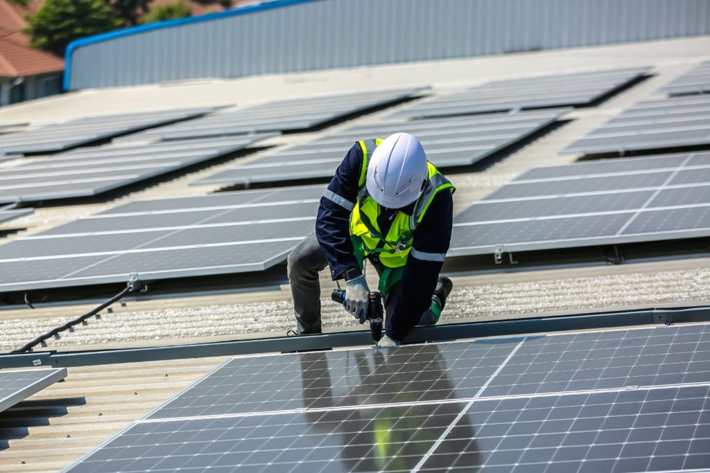 Commercial Solar Panel Installer Fitting Solar Panels To Achieve Net Zero